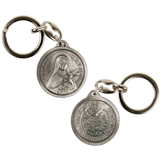 Porte clés double face en métal couleur argentée Ø 3.5 cm de sainte Thérèse avec au revers la pluie de rose.