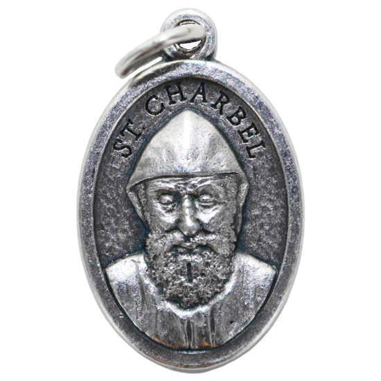 Médaille en métal couleur argentée forme ovale H. 2,2 cm. Plusieurs saints