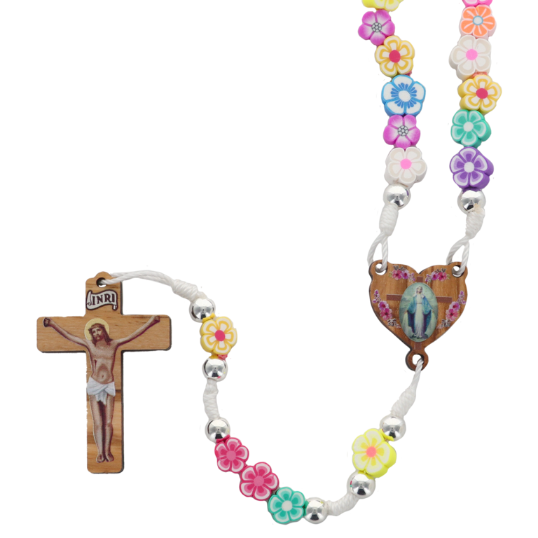 Chapelet pour enfant sur corde multicolore, grains gomme en forme de fleur.  Ø 8 mm longueur jusqu'au coeur 30 cm, avec croix en bois et Christ imprimé.